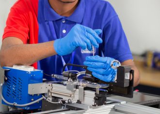 NSW Staff Working on Precision Liquid Dispensing System Maintenance