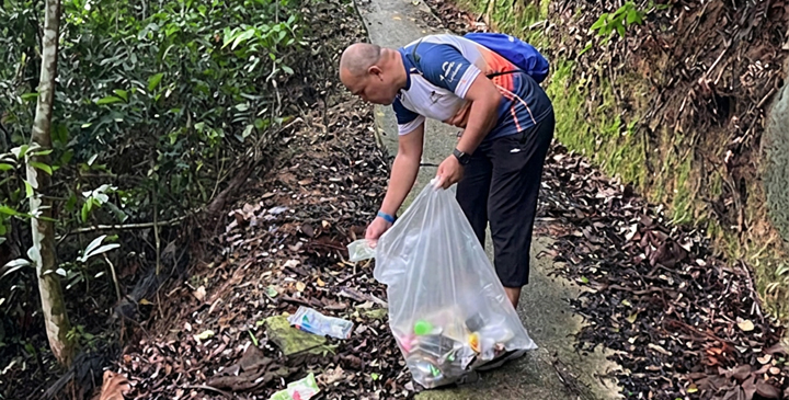 event-volunteers-collecting-trash-along-trails Community members actively participating in clean-up efforts during the event.